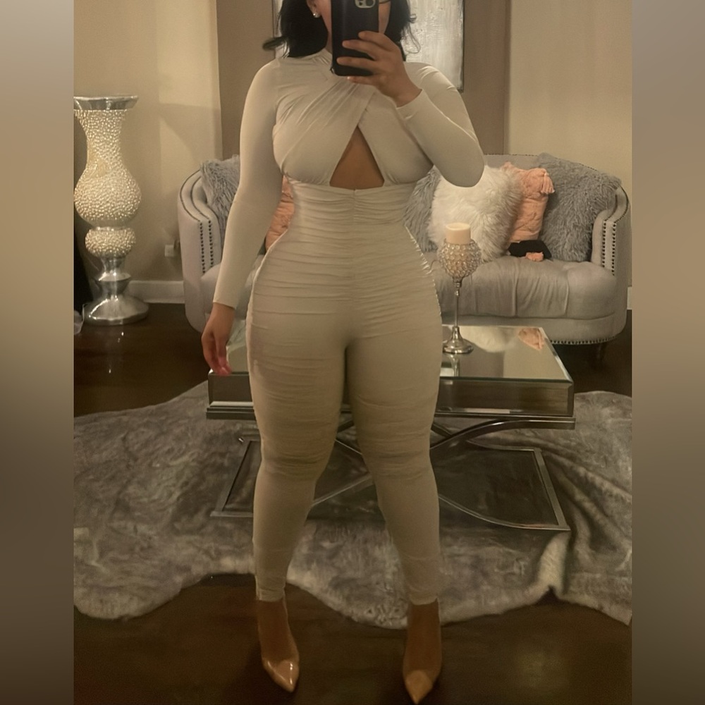 New & never worn one piece cream jumpsuit